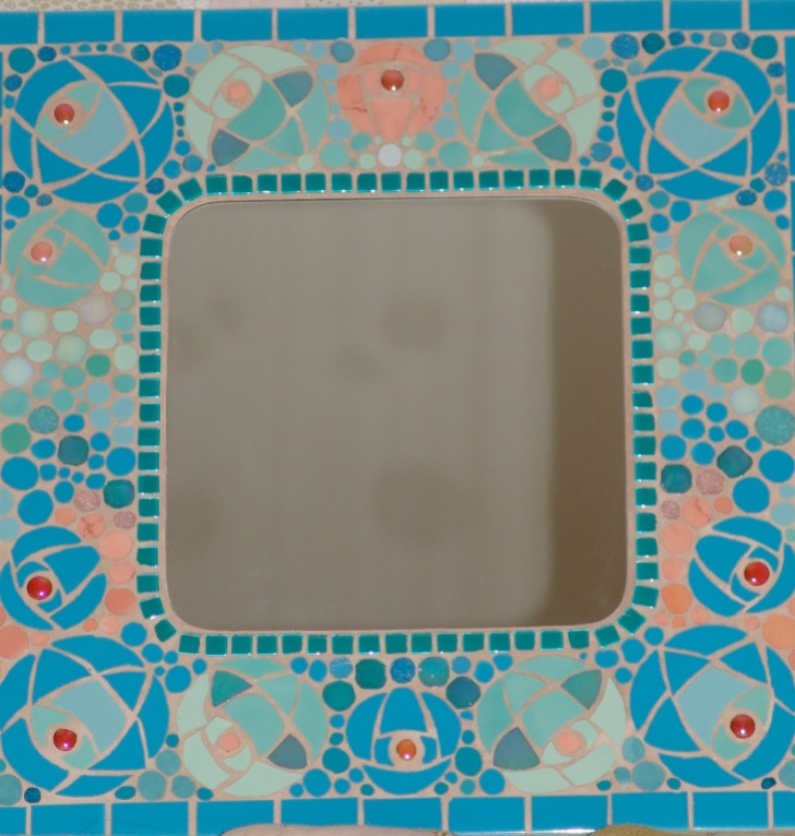 Variation on Mackintosh rose on mirror frame